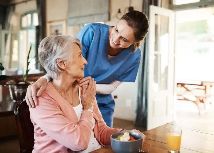 Nurse talking with older lady