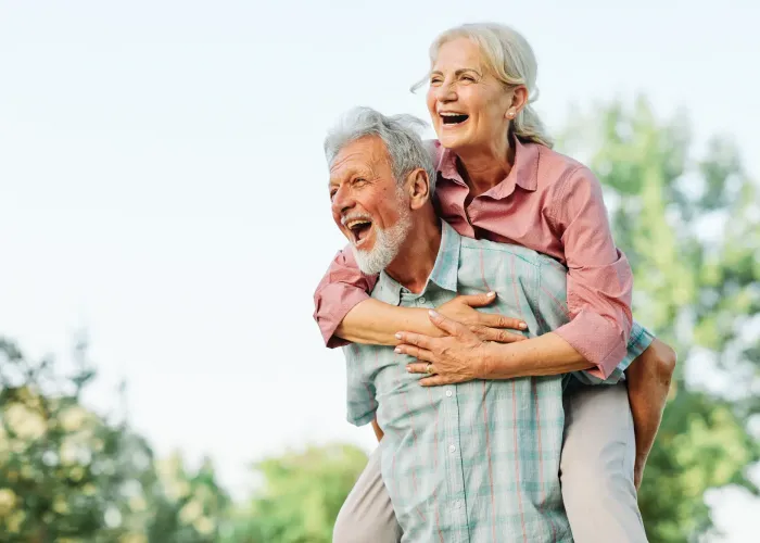 Happy couple piggybacking