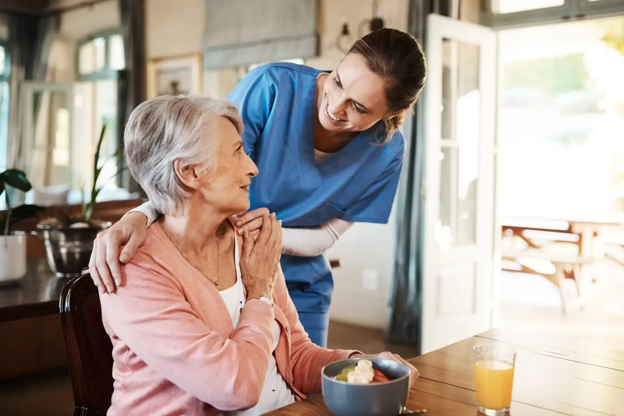 Nurse holding patients hand