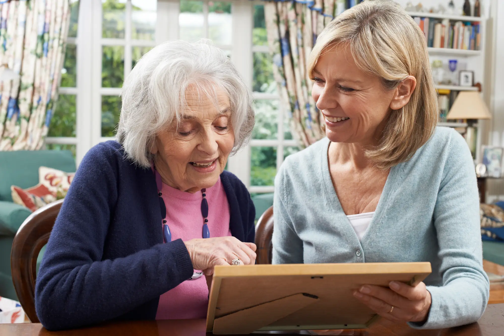 Mom with daughter looking at photos