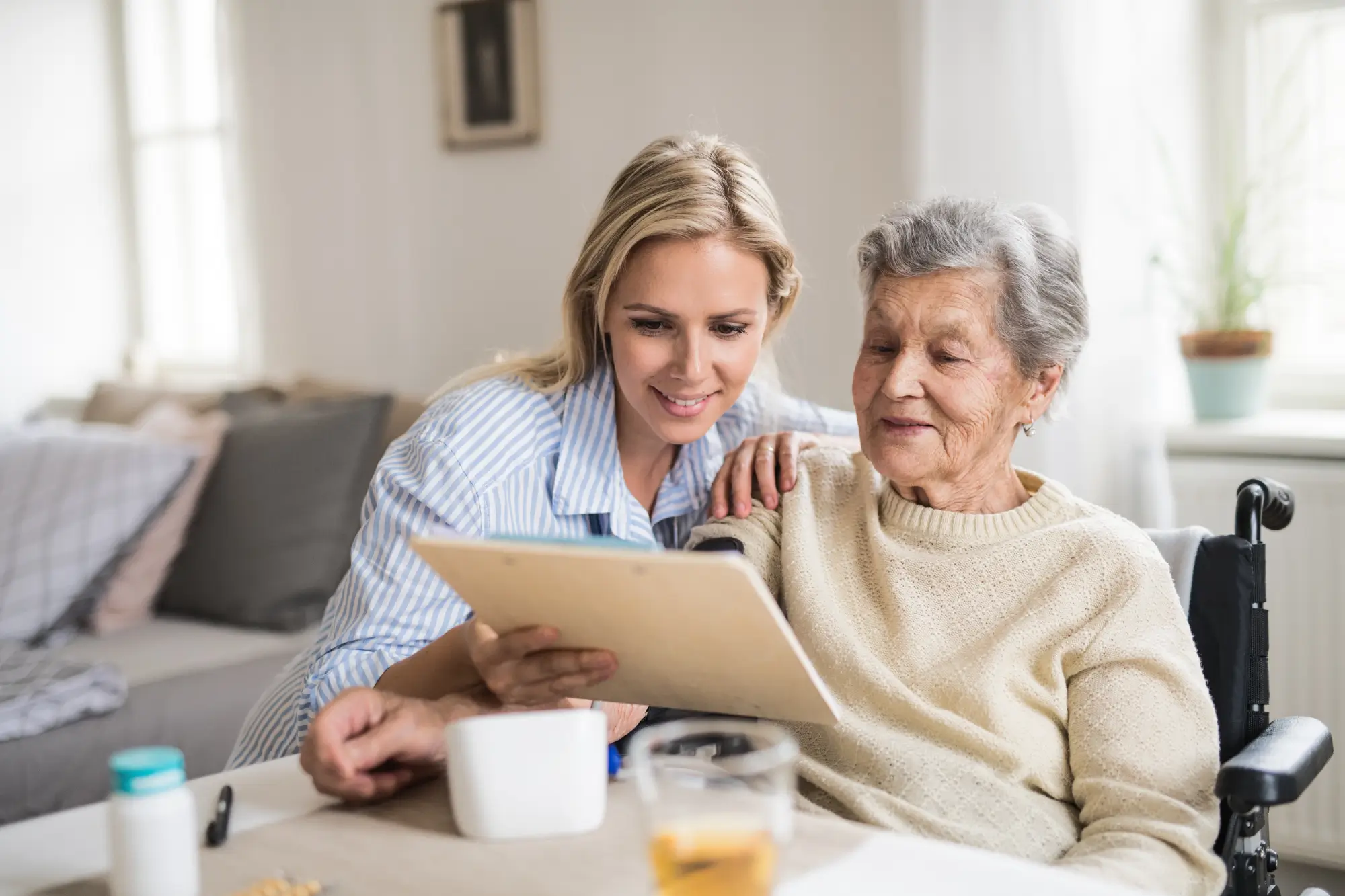 Younger lady helping older lady