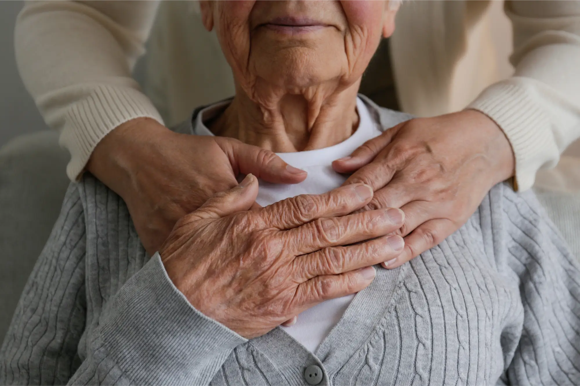 Women holding hand over heart