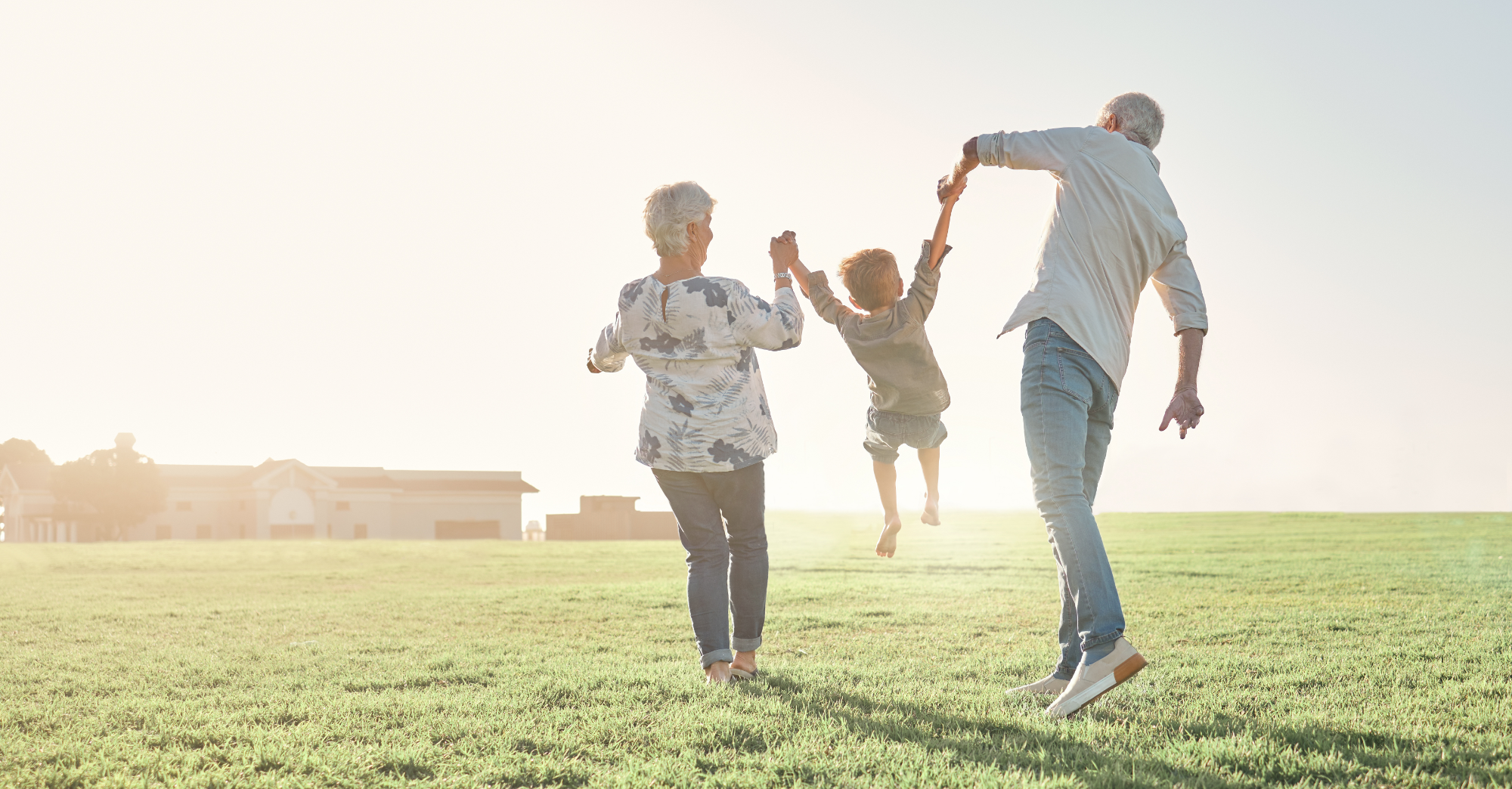 Grandparents walking with grandchild