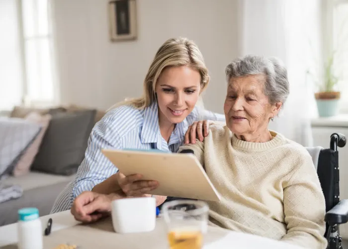 Younger lady helping older lady