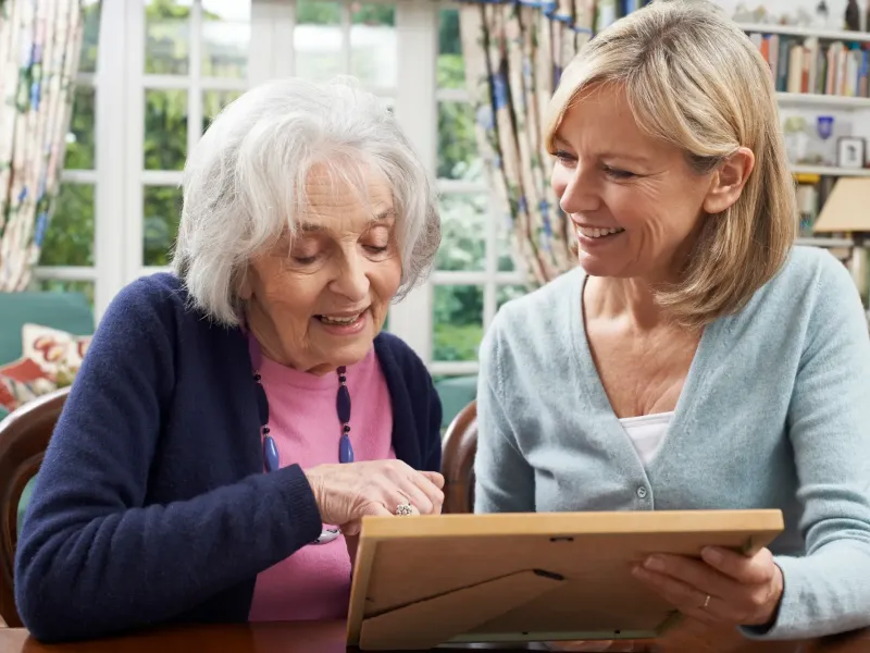 Mom with daughter looking at photos