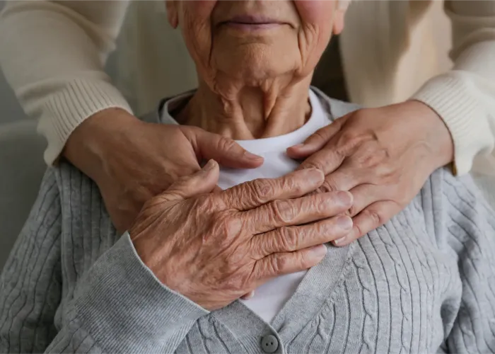 Women holding hand over heart